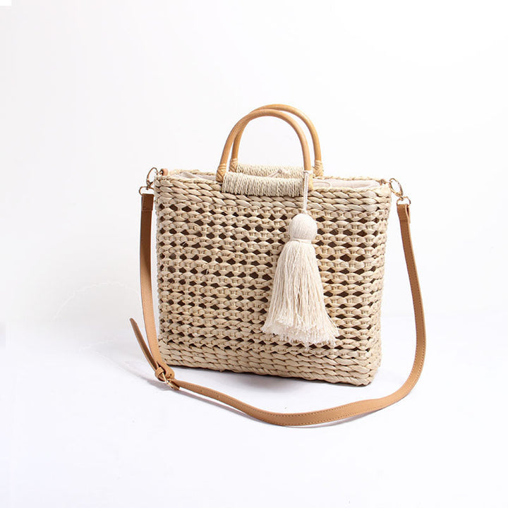 Handcrafted straw shoulder bag with decorative tassel pendant Kalsten