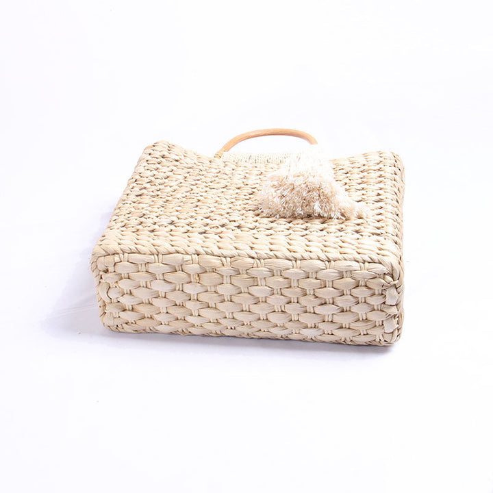 Handcrafted straw shoulder bag with decorative tassel pendant Kalsten