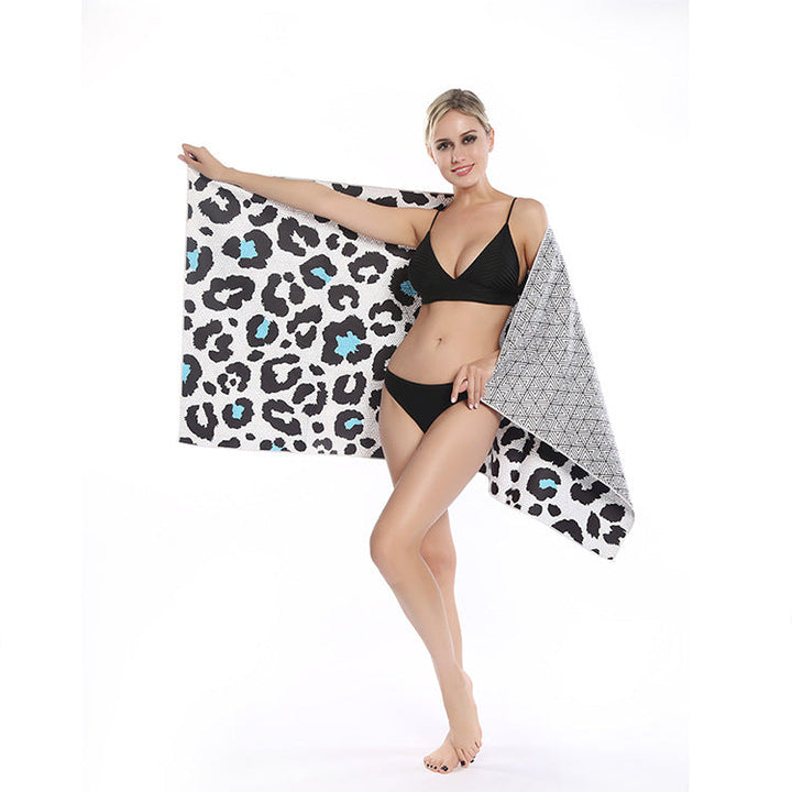 Beach towel with striking leopard motif and colorful accents Kalsten