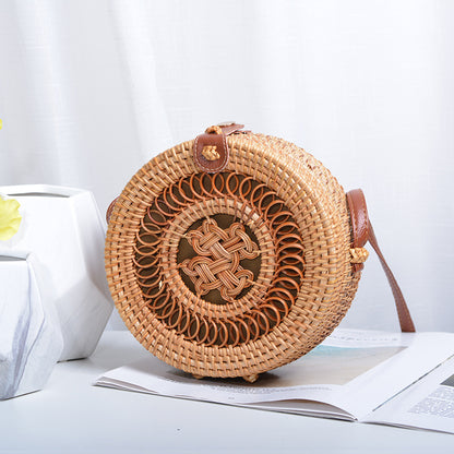 Elegant round handbag made of woven rattan Acalora