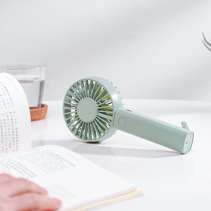 Unisex nan compact portable hand fan with rechargeable battery and USB charging port quiet operation self-standing Kalsten