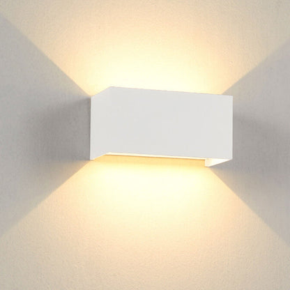 Modern, waterproof, rectangular outdoor LED wall light with up and down lighting.