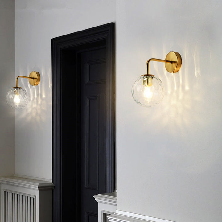 Ball Shaped Wall Lamp Minimalist Clear Rippling Glass 1-Light Bedroom Wall Mounted Lighting with Bent Arm in Black/Gold | Kalsten