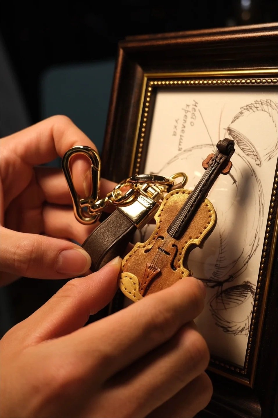 Crafted leather keychain with violin and cello