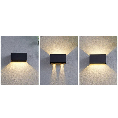 Modern, waterproof, rectangular outdoor LED wall light with up and down lighting.
