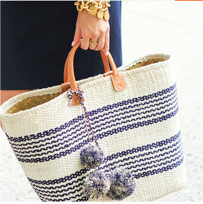 Stylish basket bag with playful pompons Kalsten
