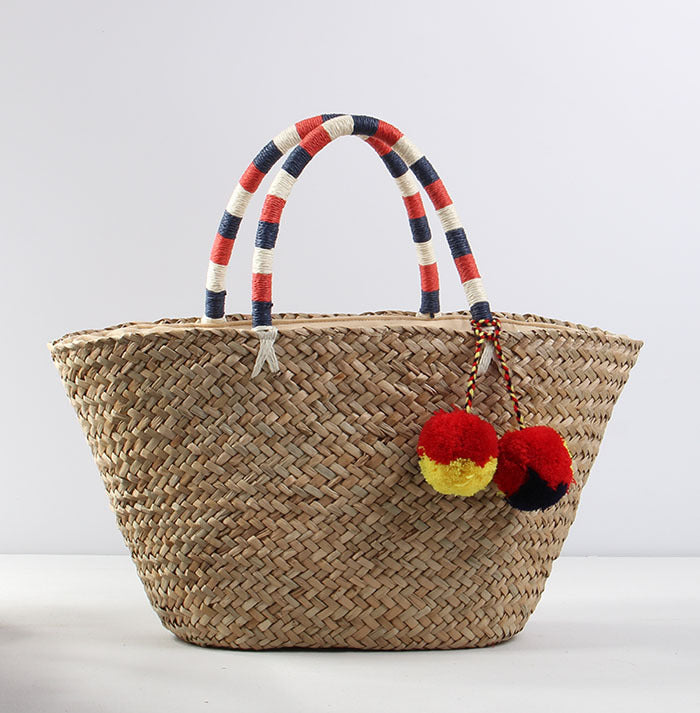 Braided beach bag with decorative pompons Kalsten