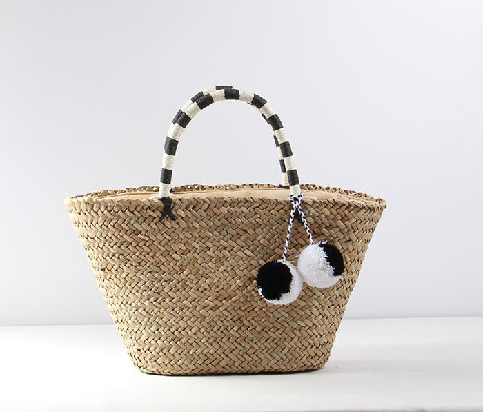 Braided beach bag with decorative pompons Kalsten