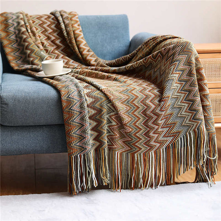 Colorful striped throw blanket with tassels