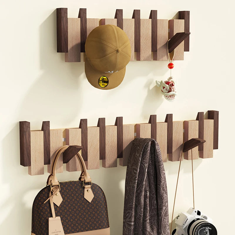 Wooden coat rack in piano design with foldable hooks | Kalsten