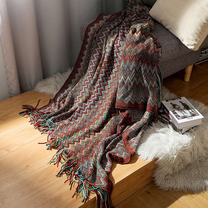Colorful striped throw blanket with tassels