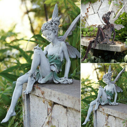 Statue of a sitting fairy in the garden