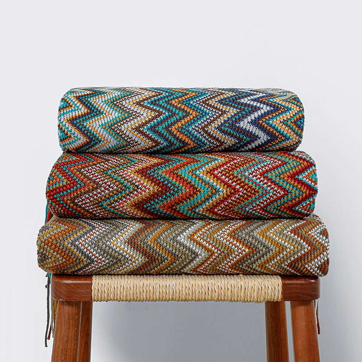 Colorful striped throw blanket with tassels