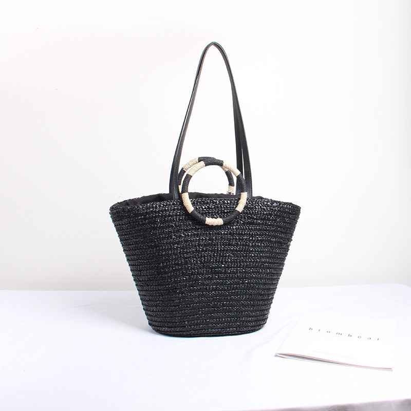 Designer shoulder bag with playful lettering and decorative tassel detail Kalsten
