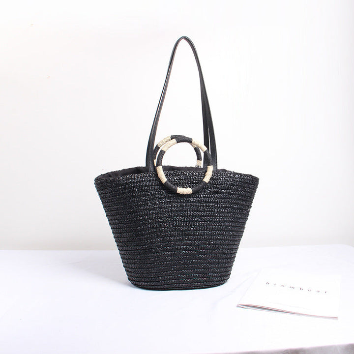 Designer shoulder bag with playful lettering and decorative tassel detail Kalsten