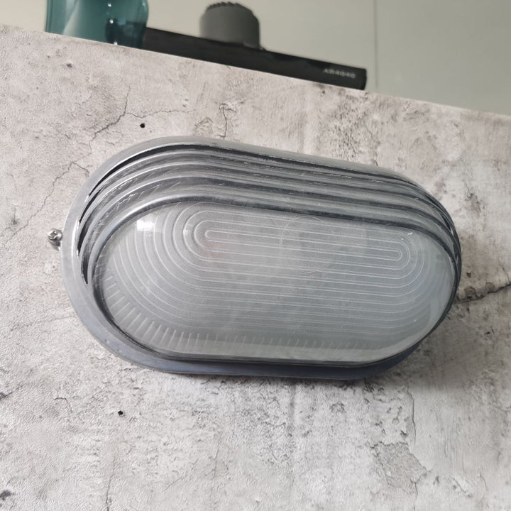 Contemporary Industrial Waterproof Aluminum Glass Frosted Oval Striped 1-Light Wall Sconce Lamp For Outdoor Patio | Kalsten