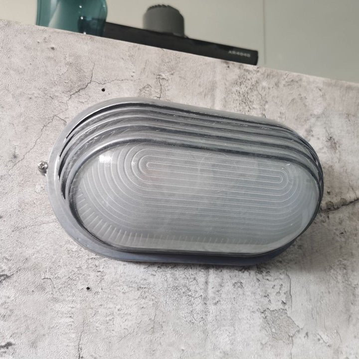Contemporary Industrial Waterproof Aluminum Glass Frosted Oval Striped 1-Light Wall Sconce Lamp For Outdoor Patio | Kalsten
