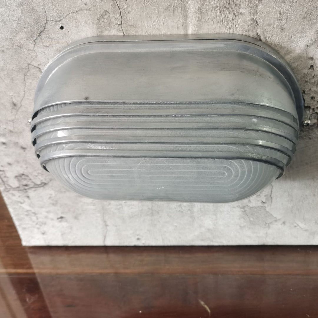 Contemporary Industrial Waterproof Aluminum Glass Frosted Oval Striped 1-Light Wall Sconce Lamp For Outdoor Patio | Kalsten