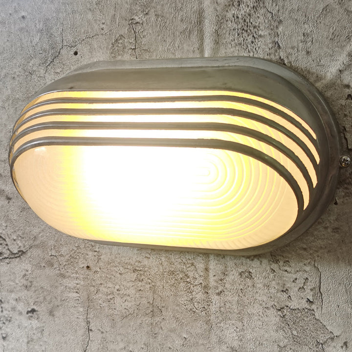 Contemporary Industrial Waterproof Aluminum Glass Frosted Oval Striped 1-Light Wall Sconce Lamp For Outdoor Patio | Kalsten