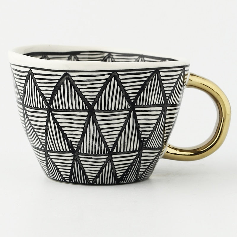 Kalsten | Cup with abstract geometric pattern and gold handle