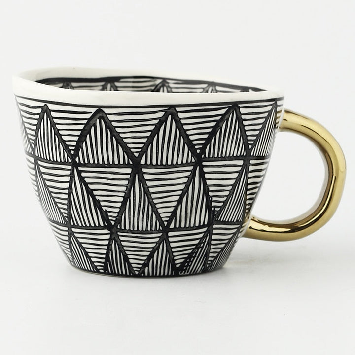 Kalsten | Cup with abstract geometric pattern and gold handle