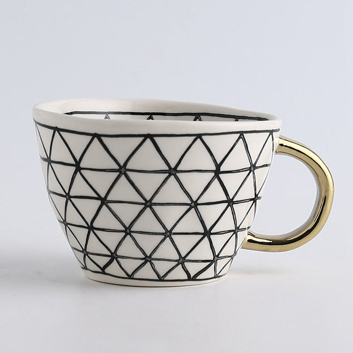 Kalsten | Cup with abstract geometric pattern and gold handle