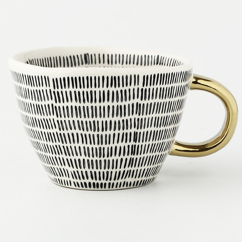 Kalsten | Cup with abstract geometric pattern and gold handle