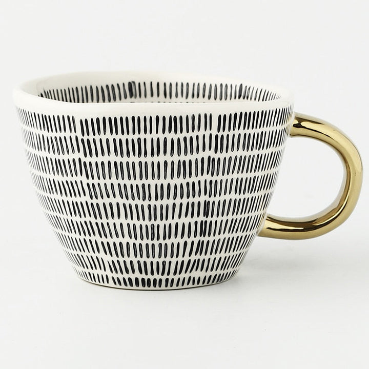 Kalsten | Cup with abstract geometric pattern and gold handle