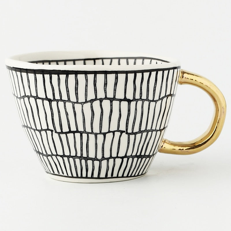 Kalsten | Cup with abstract geometric pattern and gold handle