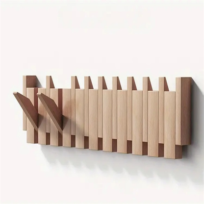 Wooden coat rack in piano design with foldable hooks | Karnz