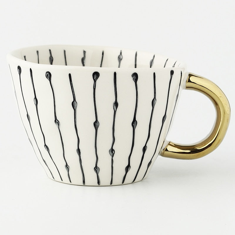 Kalsten | Cup with abstract geometric pattern and gold handle
