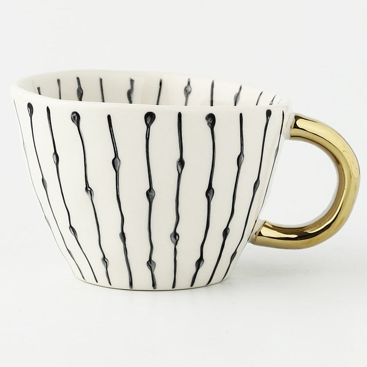 Kalsten | Cup with abstract geometric pattern and gold handle
