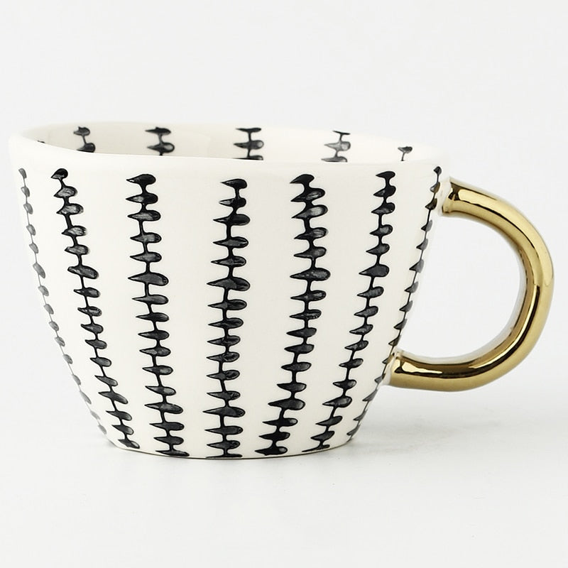 Kalsten | Cup with abstract geometric pattern and gold handle