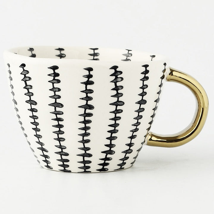 Kalsten | Cup with abstract geometric pattern and gold handle