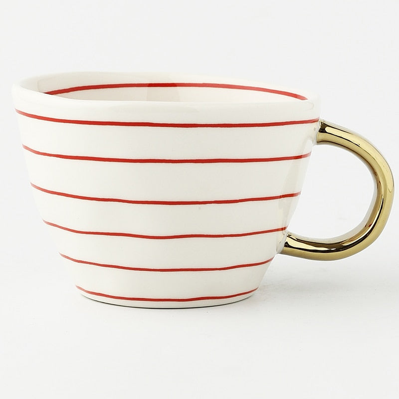 Kalsten | Cup with abstract geometric pattern and gold handle