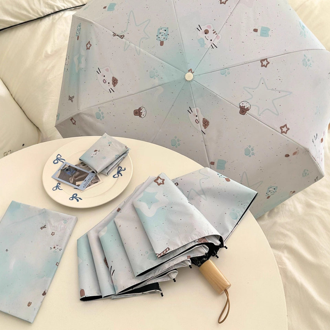Women's compact folding umbrella with cute Kalsten motif