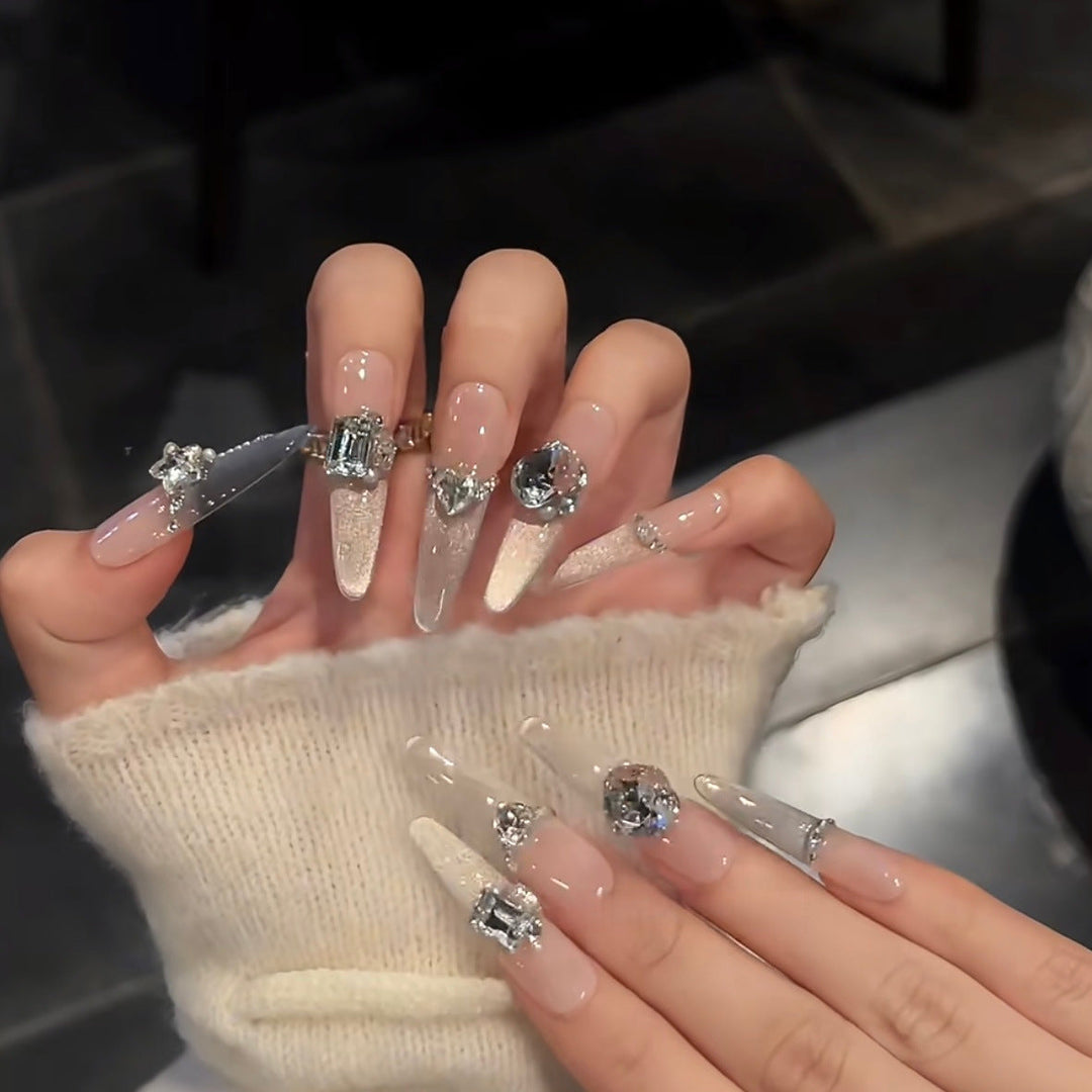 Glamorous artificial nails with sparkling rhinestone embellishments Kalsten