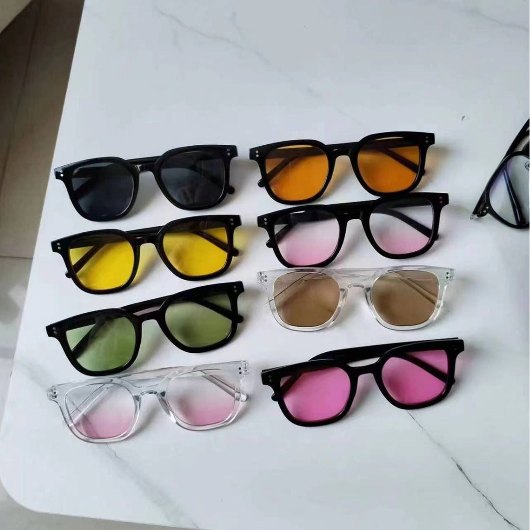 Women striking retro sunglasses with yellow-tinted lenses Kalsten