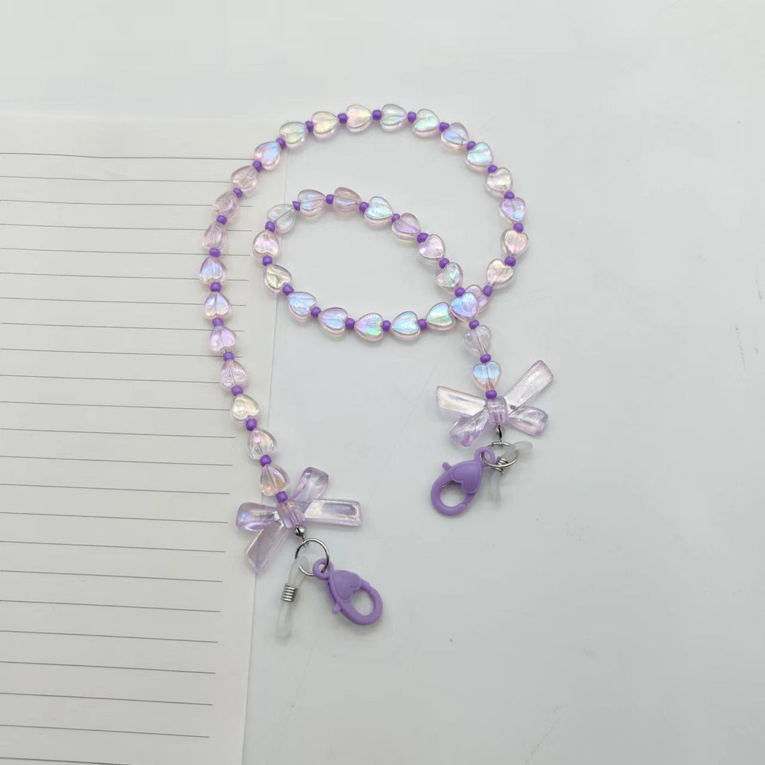 Fashionable glasses holder chain with heart and flower motifs Kalsten