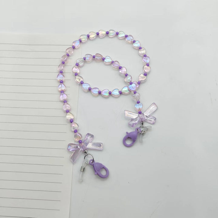 Fashionable glasses holder chain with heart and flower motifs Kalsten