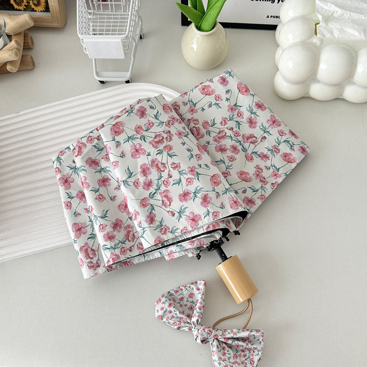 Women's folding umbrella with floral design and practical storage system Kalsten
