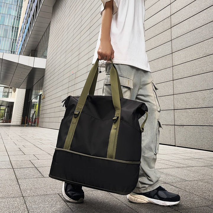 Sporty shoulder bag with water-repellent material and sturdy carrying handles Kalsten