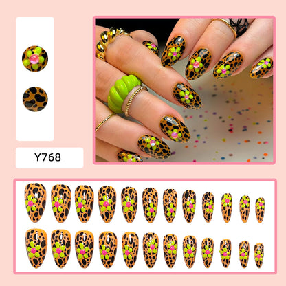 Artificial nails in modern animal patterns with floral accents Acalora