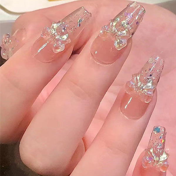Artificial nails with glitter accents and playful motifs Kalsten