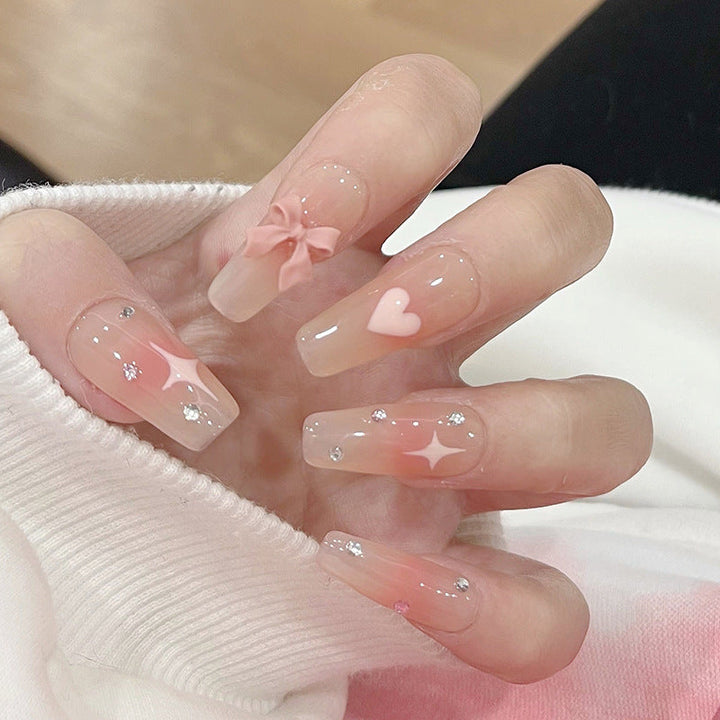 Artificial nails with heart accent and glamorous decorations Kalsten