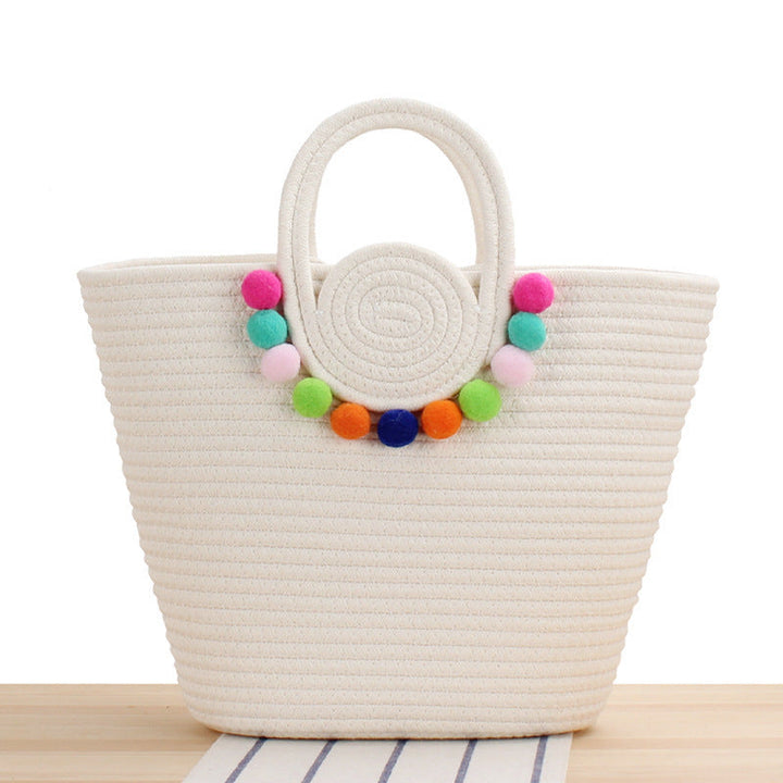 Fashionable handbag with playful pompom decoration Kalsten