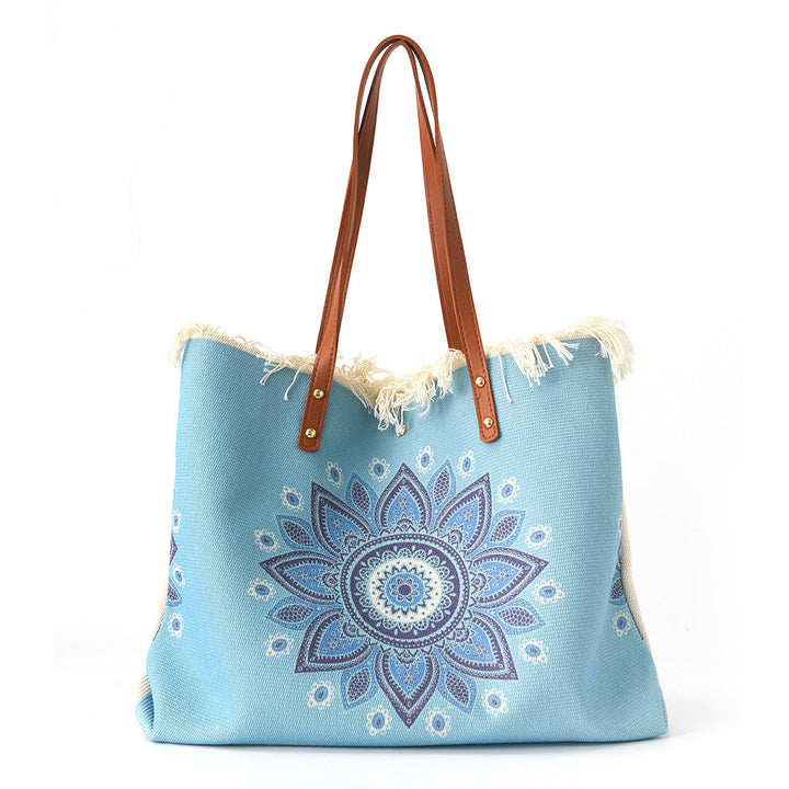 Beach bag with floral pattern and fringes Kalsten