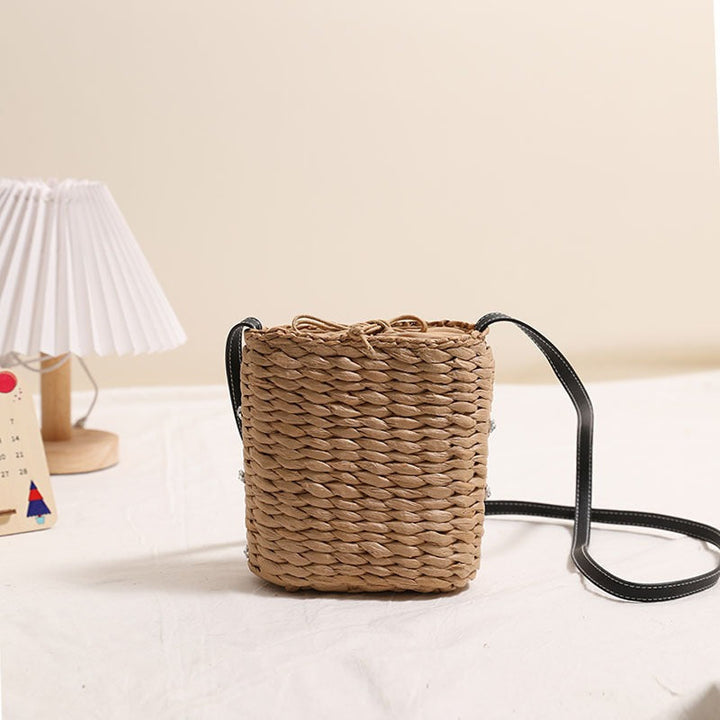 Bag made of woven natural material with sparkling appliqués Kalsten