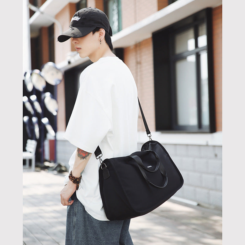 Sporty travel bag with ergonomic carrying handles and versatile compartments Kalsten