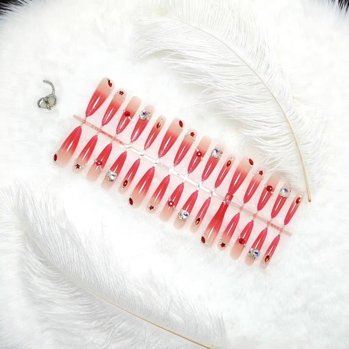 Glamorous artificial nails with sparkling ombre effect and elegant embellishments Kalsten